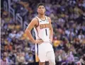  ??  ?? Guard Devin Booker and the Suns are long shots to make the playoffs at 26-39 when play resumes in Florida.