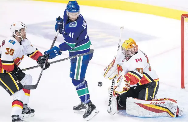  ?? — THE CANADIAN PRESS FILES ?? Canucks power forward prospect Jonah Gadjovich, seen here during a pre-season game in September, nearly completed a Gordie Howe hat trick Wednesday in the Utica Comets’ 4-1 AHL win over the Laval Rocket, scoring once and engaging in a spirited scrap.