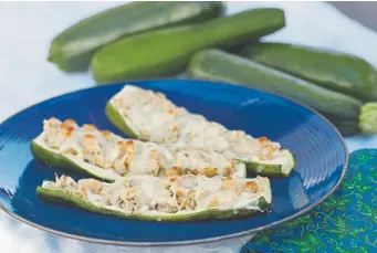  ?? Amy Brothers, The Denver Post ?? Zucchini boats filled with with a mixture of sautéed sweet onion, zucchini and mozzarella.