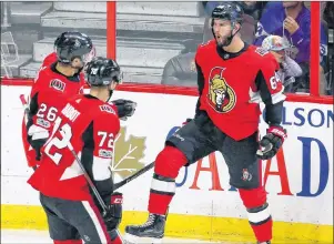  ?? CP PHOTO ?? Ottawa Senators forward Tyler Randell (64) celebrates his goal against the Toronto Maple Leafs with forward Ben Sexton (26) and defenceman Thomas Chabot (72) during first period NHL preseason hockey in Ottawa on Sept. 18.