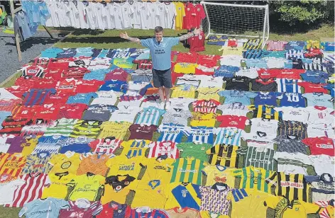  ??  ?? A football shirt collector has amassed an incredible collection of over 364 shirts, from countries across the world.