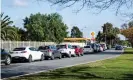  ?? Photograph: Morgan Sette/AAP ?? Cars lined up at a Covid-19 testing clinic in Adelaide’s Elizabeth Park on Tuesday as South Australia went into lockdown.