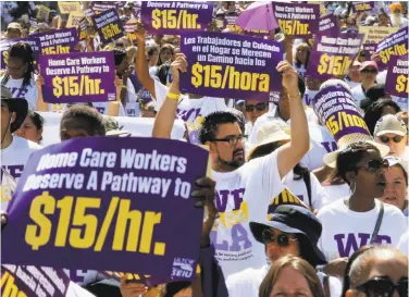  ?? Luis Sinco / Los Angeles Times via Getty Images 2015 ?? Hundreds of Los Angeles home care workers march for a higher minimum wage, now $10.50 in California.