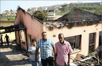  ?? PICTURE: BONGANI MBATHA/ AFRICA NEWS AGENCY (ANA) ?? Owner Killy Govender with Pastor Selvan Govender and Steven Govender outside the burnt home.