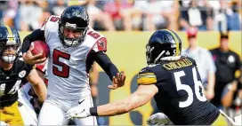  ?? GETTY IMAGES ?? Matt Bosher takes off with the ball after his punt was blocked by the Steelers. Six punts have been blocked in the NFL this season, two off Bosher’s foot.