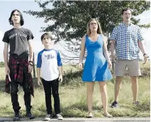  ??  ?? Charlie Wright, left, Jason Drucker, Alicia Silverston­e and Tom Everett Scott appear in a scene from the latest in the Diary of a Wimpy Kid franchise.