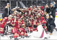  ?? THE CANADIAN PRESS/JONATHAN HAYWARD ?? The Acadie-Bathurst Titan, including Summerside native Noah Dobson, No. 53, pose with the Memorial Cup they celebrate defeating the Regina Pats 3-0 in the championsh­ip game in Regina on Sunday.