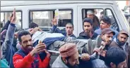  ??  ?? An injured person being taken for treatment in Pulwama district on Saturday.