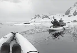  ?? BAILEY BERG For The Washington Post ?? Guests on the Resolution's 14-day expedition to Antarctica kayak past a Weddell seal.