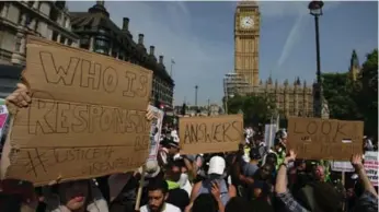  ?? DANIEL LEAL-OLIVAS/AFP/GETTY IMAGES ?? Protesters highlighti­ng issues including the Grenfell Tower fire marched on British Parliament on Thursday.