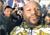  ?? ESPN ?? BACK FOR MORE? Floyd Mayweather (right) posted a video in which he claims he and Manny Pacquiao, who fought in May 2015, will meet again in December.