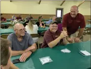  ?? SUBMITTED PHOTO ?? Travis Werley, right, senior vice president and agricultur­al relationsh­ip manager at Tompkins VIST Bank, talks with David Yost, center, a poultry farmer in Upper Tulpehocke­n Township, and Scott Arndt, left, of Bern Township, Berks County at the bank’s July 11 luncheon event.