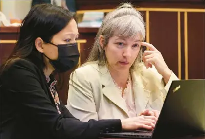  ?? RICARDO RAMIREZ BUXEDA/ORLANDO SENTINEL ?? Assistant Public Defender Catherine Conlon, left, speaks to defendant Danielle Redlick during jury selection at the Orange County Courthouse on Monday. Redlick is charged with second-degree murder and tampering with evidence in the death of Michael Redlick, a University of Central Florida faculty member who was found dead in the couple’s Temple Drive home on Jan. 12, 2019.