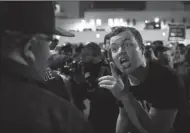  ?? ALLEN J. SCHABEN/LOS ANGELES TIMES FILE PHOTOGRAPH ?? Ian Jameson, of Pasadenans and Altadenans Against Police Violence, shouts at a President Trump supporter during a protest against Trump, at the Beverly Gardens Park in Beverly Hills on March 13.