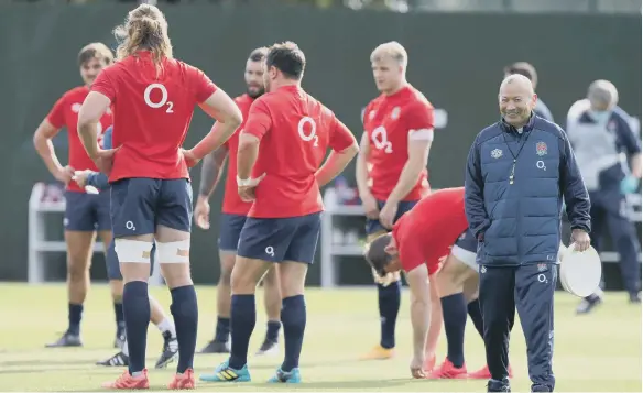  ??  ?? England head coach Eddie Jones (right) during a training session at The Lensbury, London.