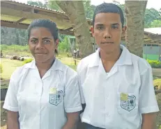  ??  ?? Ahmadiyya Muslim Secondary School newly inducted headboy Kristian Deo (right), and headgirl Teresia Nei after their school’s prefects’ induction outside Labasa Town on February 16, 2018.