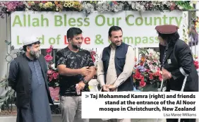  ?? Lisa Maree Williams ?? > Taj Mohammed Kamra (right) and friends stand at the entrance of the Al Noor mosque in Christchur­ch, New Zealand