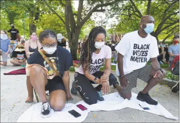  ?? Matthew Brown / Hearst Connecticu­t Media ?? From left, Samiah Morgan, Doris Walden and Wilner Joseph, all of Stamford, kneel with protesters in front of Greenwich Town Hall Saturday as they rally for police reform after the death of George Floyd.