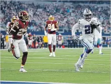  ?? RON JENKINS THE ASSOCIATED PRESS ?? Dallas Cowboys running back Ezekiel Elliott, right, runs past Washington’s Ha Ha Clinton-Dix for a touchdown on Thursday.