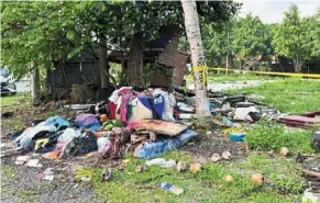  ?? — Photo courtesy of Roslina Rahman ?? piles of rubbish at the taman tasik titiwangsa residentia­l area in Kuala lumpur.