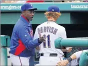  ?? By Matthew Emmons, US Presswire ?? Encouragem­ent: Manager Ron Washington, left, talks with Yu Darvish, who gave up four first-inning runs Monday.