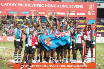  ?? — AFP photo ?? Fiji celebrate after winning the Cup final against France on the Third day at the Hong Kong Sevens rugby tournament.