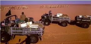  ??  ?? 101s meet traditiona­l desert transporta­tion in the Sudan