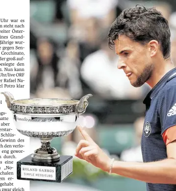  ?? BILD: SN/AP/ ?? So nah und doch noch fern für Dominic Thiem: die Paris-Trophäe.