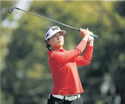  ??  ?? Lydia Ko hits her tee shot on the seventh hole in the second round. LEADING SECOND ROUND SCORES