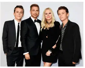  ??  ?? ABOVE: Rob with his wife of 25 years, jewellery designer Sheryl, and his sons John Owen (left) and Matthew at the Roast Of Rob Lowe held recently in Los Angeles.
