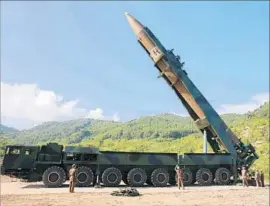  ?? Korean Central News Agency ?? ALTHOUGH it appears that North Korea’s unarmed Hwasong-14 could reach the U.S. mainland, a heavy nuclear warhead would significan­tly reduce its range.