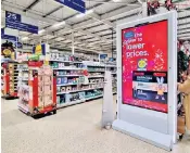  ?? ?? Tesco is ramping up its in-store advertisin­g with screens in an increasing number of stores