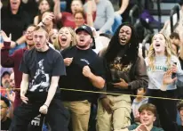  ?? STAN GODLEWSKI/SPECIAL TO THE COURANT PHOTOS ?? Fans cheer a win by East Hartford Jaeckez Mendez over Anthony Basile of Xavier the 138 lb class at the State Open Wrestling Championsh­ip. Mendez won with a pin in 1:27.