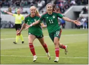  ?? PHOTO BY RAUL ROMERO JR. ?? Mexico midfielder Jacqueline Ovalle, right, celebrates with forward Mayra Pelayo after Ovalle scored a goal against Paraguay in the second half of Sunday’s match.