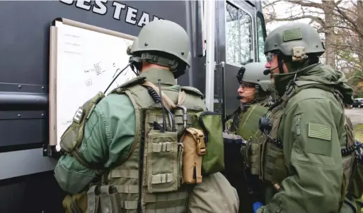  ?? PROVIDED ?? SWAT officers who are part of the Northern Illinois Police Alarm System, a mutual-aid group, during a training exercise.