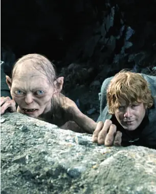  ??  ?? Left to right: Elijah Wood’s Frodo reaches for the fabled ring; Andy Serkis as Gollum with Sean Astin as Samwise.