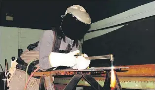  ?? — Photo courtesy of the Office to Advance Women Apprentice­s ?? An apprentice welder at work.