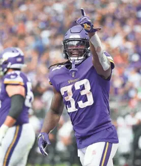  ?? BEN LUDEMAN/USA TODAY SPORTS ?? Vikings running back Dalvin Cook celebrates after rushing for a touchdown against the Falcons in the third quarter Sunday.