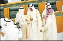  ?? KUNA photo ?? His Highness the Prime Minister congratula­tes the Speaker of the National Assembly Ahmad Al-Saadoun.