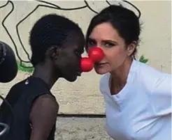  ??  ?? Empowering: Victoria Beckham practises self-defence with young women supported by the charity BoxGirls in Korogocho