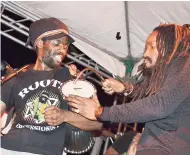  ??  ?? Kabaka Pyramid (right) with a percussion­ist.