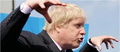  ??  ?? Getting a grip: Boris Johnson during his tour of south London constituen­cies yesterday