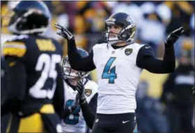  ?? KEITH SRAKOCIC — THE ASSOCIATED PRESS ?? Jacksonvil­le Jaguars kicker Josh Lambo (4) watches his field goal during the second half of an NFL divisional football AFC playoff game against the Pittsburgh Steelers in Pittsburgh, Sunday.