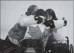  ?? Associated Press photo ?? Canada's Dennis Thiessen, left, Mark Ideson, center, and Ina Forrest celebrate their victory over South Korea in the Wheelchair Curling Bronze Medal Game at the Gangneung Curling Centre in Gangneung, South Korea at the 2018 Winter Paralympic­s Saturday.