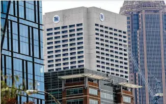  ?? JOHN SPINK/ JOHN. SPINK@ AJC. COM ?? A Tower Square signature logo nowperches near the top ofwhatwas the old AT& T building at 675West Peachtree Street in Midtown Atlanta.