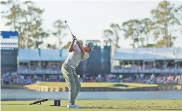  ??  ?? Tiger Woods of the United States plays his shot from the 17th tee during the first round of The PLAYERS Championsh­ip on The Stadium Course at TPC Sawgrass in Ponte Vedra Beach, Florida. — AFP photo