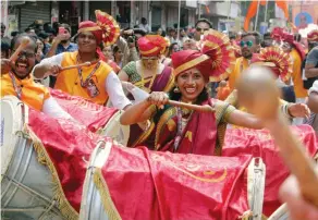  ?? — AP ?? A woman beats a drum as she participat­es in a rally to celebrate Maharashtr­ian New Year in Mumbai on Sunday.