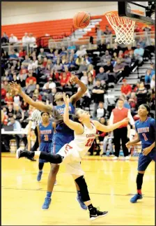  ?? MARK HUMPHREY ENTERPRISE-LEADER ?? Farmington sophomore Makenna Vanzant absorbs a foul while making a driving layup during Friday’s semifinal action versus Little Rock Parkview. For the second consecutiv­e year, Parkview ended Farmington’s State 5A girls basketball tournament run by...