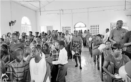  ?? PHOTOS BY CHRISTOPHE­R THOMAS ?? Several of the 170 St Elizabeth-based students and their family members participat­e in activities during an awards ceremony held by the Canada-based Children of Light Outreach Foundation to recognise the students for their academic achievemen­ts, held at the Jointwood Seventh-day Adventist Church in Jointwood, St Elizabeth, on Sunday.