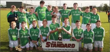  ??  ?? The Cloughbawn boys after completing their Under-14 double.